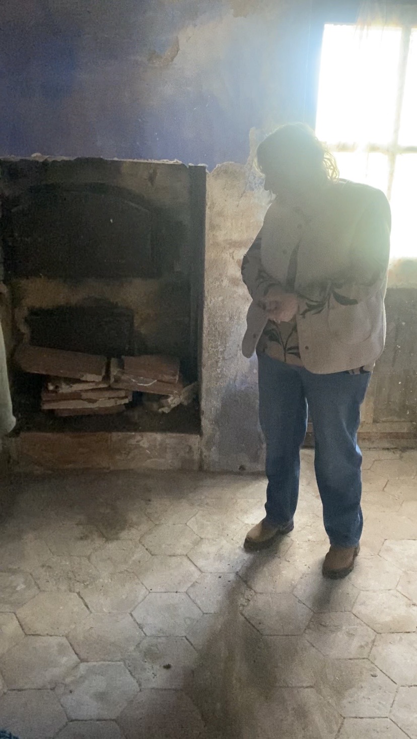 Stone fireplace and hexagonal tile floor