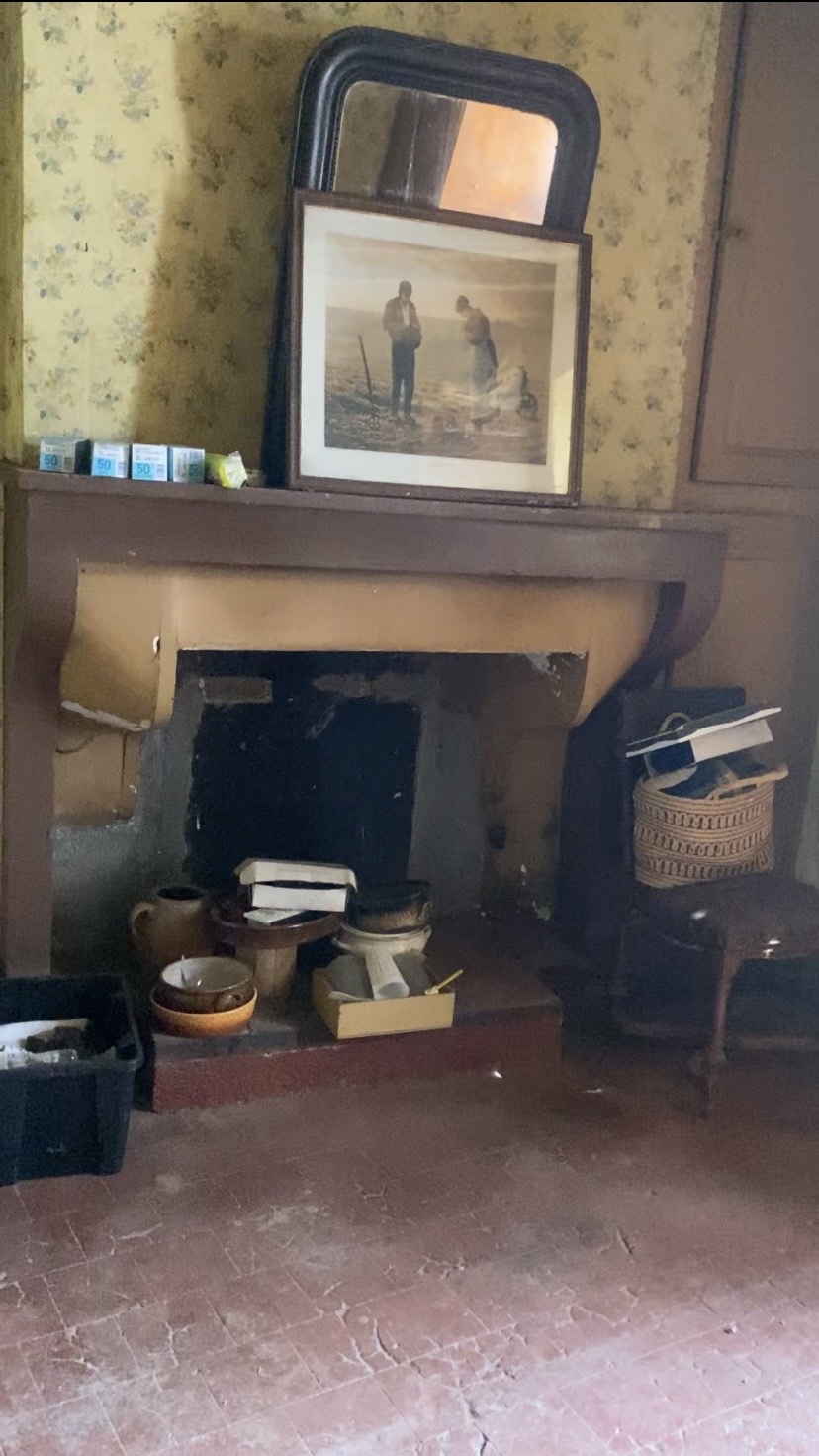 Original fireplace with antique mirror